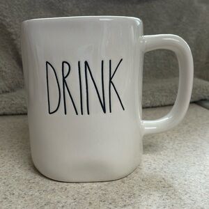 Rae Dunn “Drink” coffee mug. Classic white with black lettering.